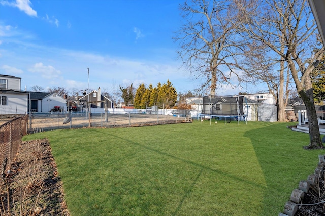 view of yard featuring a trampoline