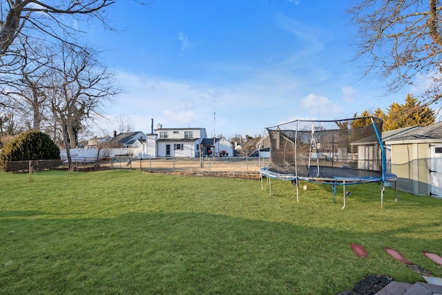 view of yard with a trampoline