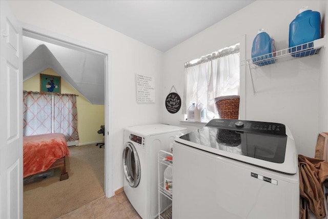 laundry area with light colored carpet, independent washer and dryer, and baseboard heating