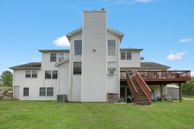 back of house with a wooden deck, a yard, and central AC unit