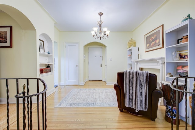 entryway with a chandelier and light wood-type flooring