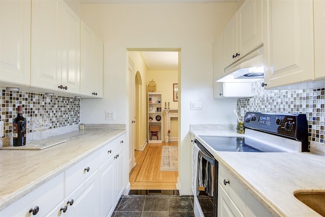 kitchen with range with electric stovetop, white cabinetry, and decorative backsplash