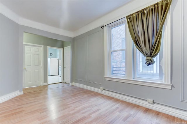 empty room with light wood-type flooring