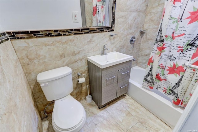 full bathroom featuring vanity, tile walls, toilet, and shower / bathtub combination with curtain