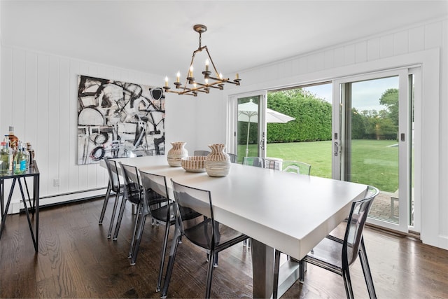 dining room featuring a baseboard radiator, an inviting chandelier, and dark hardwood / wood-style flooring