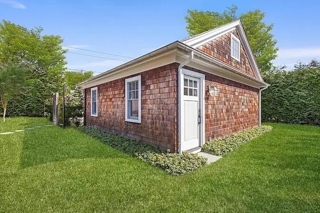 view of home's exterior with a lawn