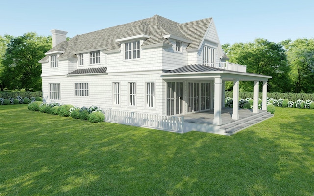 rear view of house with a lawn, a sunroom, and a patio