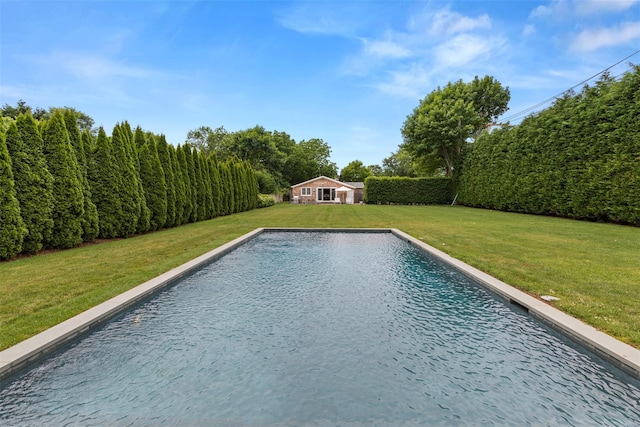 view of pool featuring an outbuilding and a lawn