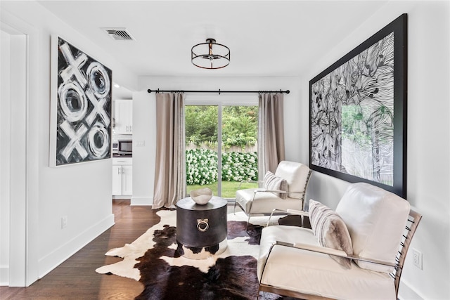 living area with dark wood-type flooring