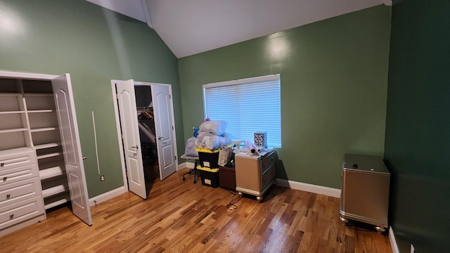 office area with lofted ceiling and light hardwood / wood-style floors