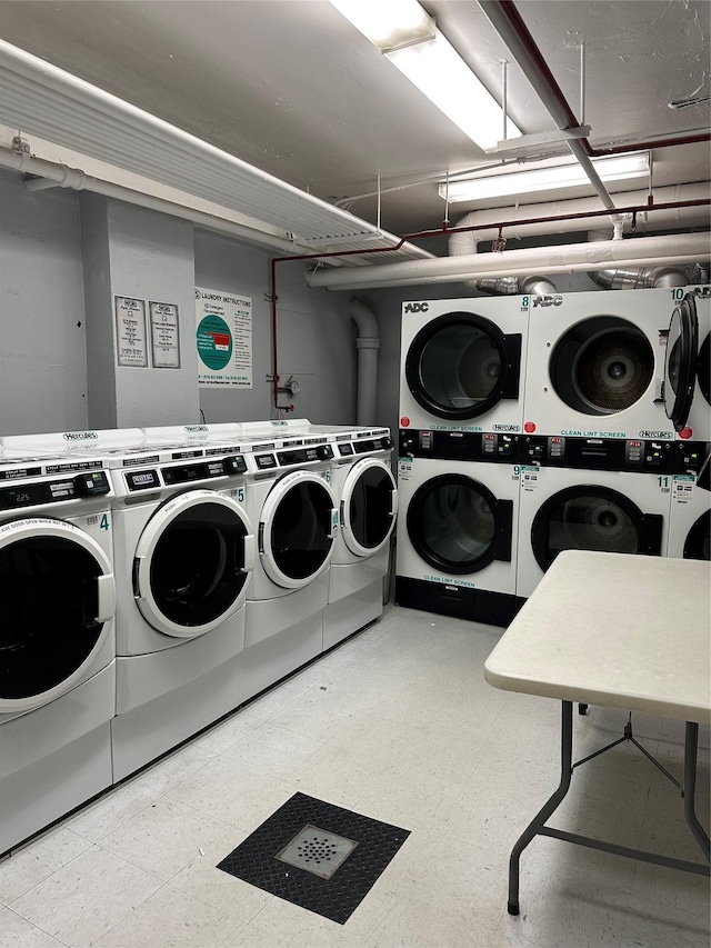 laundry area with separate washer and dryer and stacked washing maching and dryer