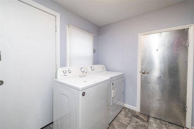 laundry room featuring washing machine and clothes dryer