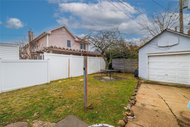 view of yard with an outbuilding and a garage