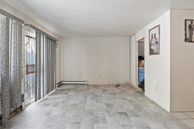 unfurnished room featuring baseboard heating