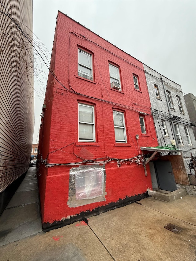 view of building exterior with cooling unit