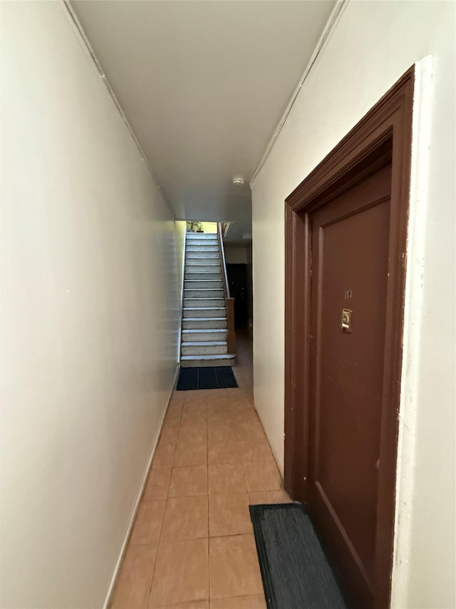 hallway with light tile patterned floors