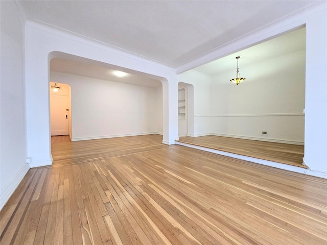 empty room featuring wood-type flooring