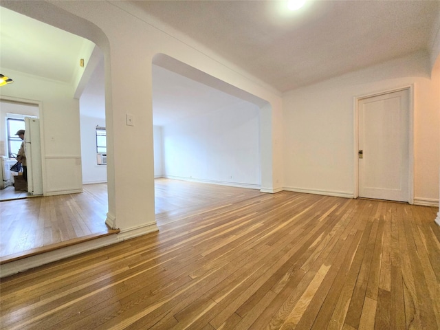 spare room with hardwood / wood-style flooring