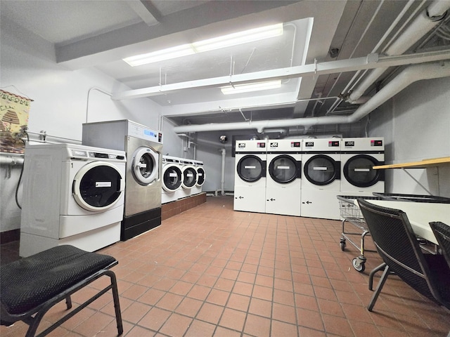 laundry area with tile patterned flooring, separate washer and dryer, and stacked washer and clothes dryer