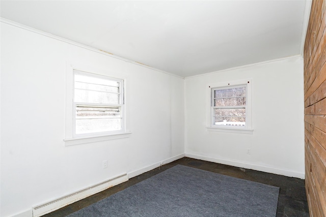 unfurnished room featuring baseboard heating