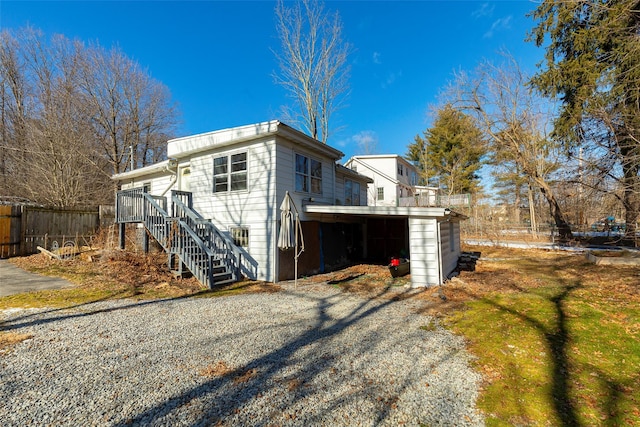 back of property featuring a carport