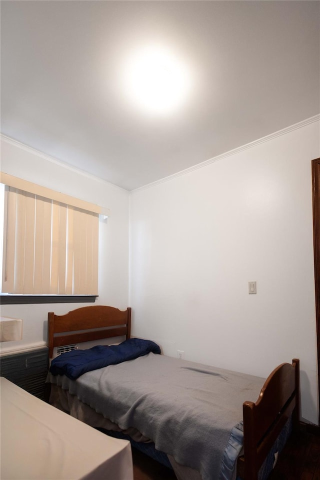 bedroom with ornamental molding