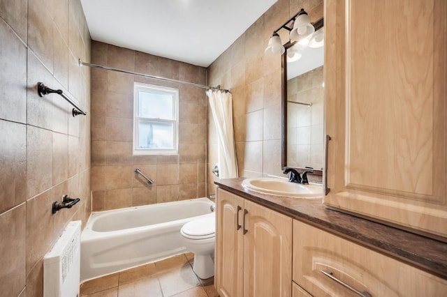 full bathroom featuring tile walls, tile patterned flooring, shower / tub combo, vanity, and toilet