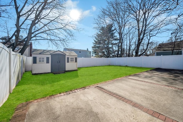 view of yard with a storage unit and a patio area