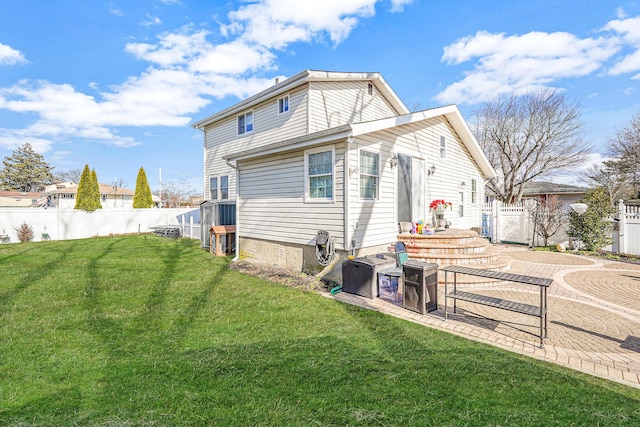 back of house with a yard