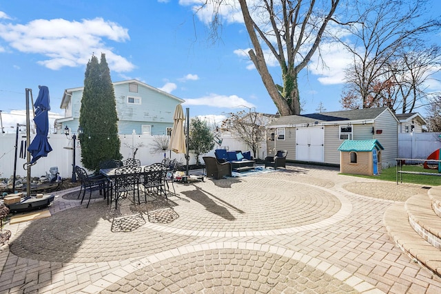 view of patio / terrace featuring outdoor lounge area and a shed