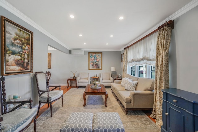 living room with ornamental molding, a wall unit AC, and light hardwood / wood-style flooring