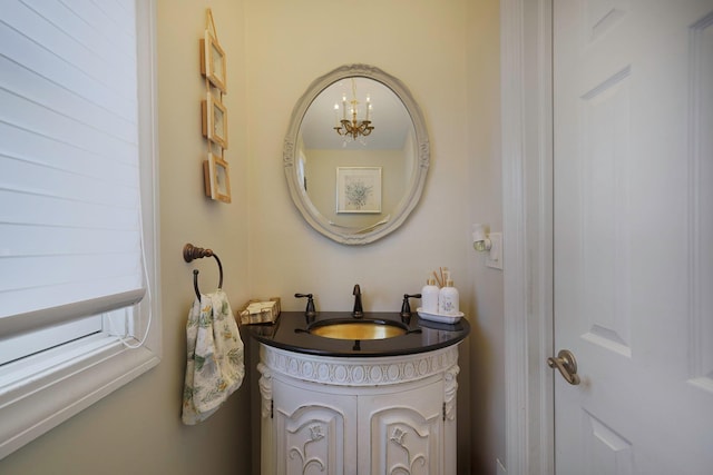 bathroom featuring vanity and an inviting chandelier