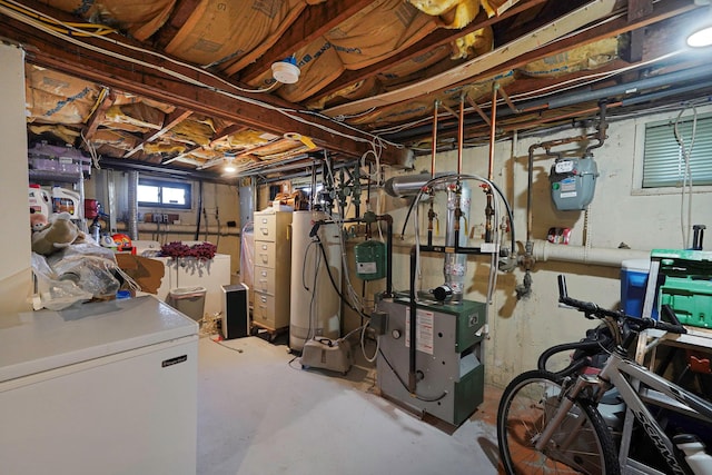 basement featuring gas water heater and refrigerator