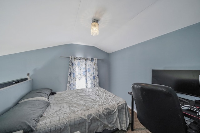 bedroom with carpet flooring and vaulted ceiling