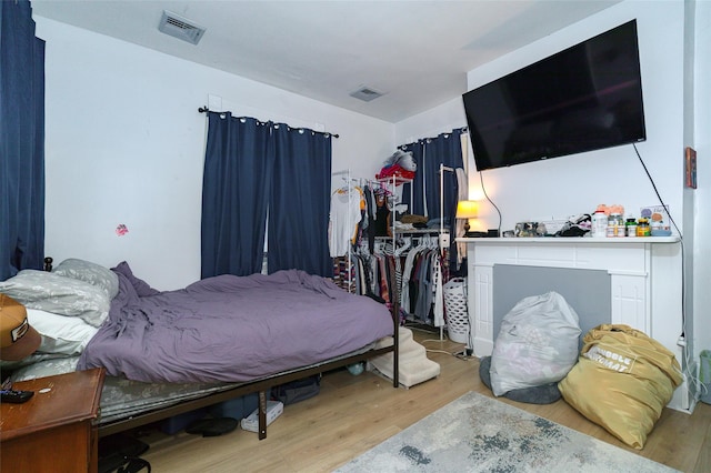 bedroom with light wood-type flooring