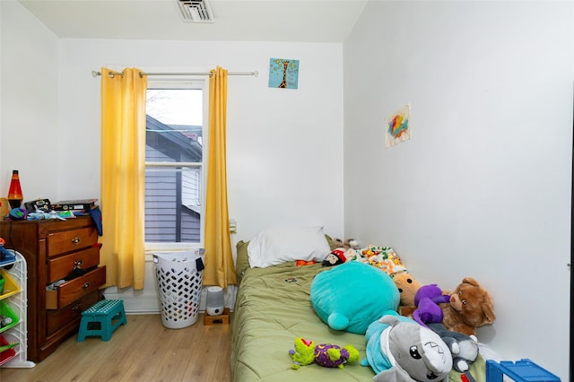 bedroom featuring light wood-type flooring