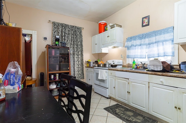 kitchen featuring white cabinetry, sink, white electric range, and light tile patterned flooring