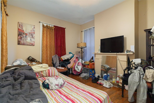 bedroom with dark wood-type flooring