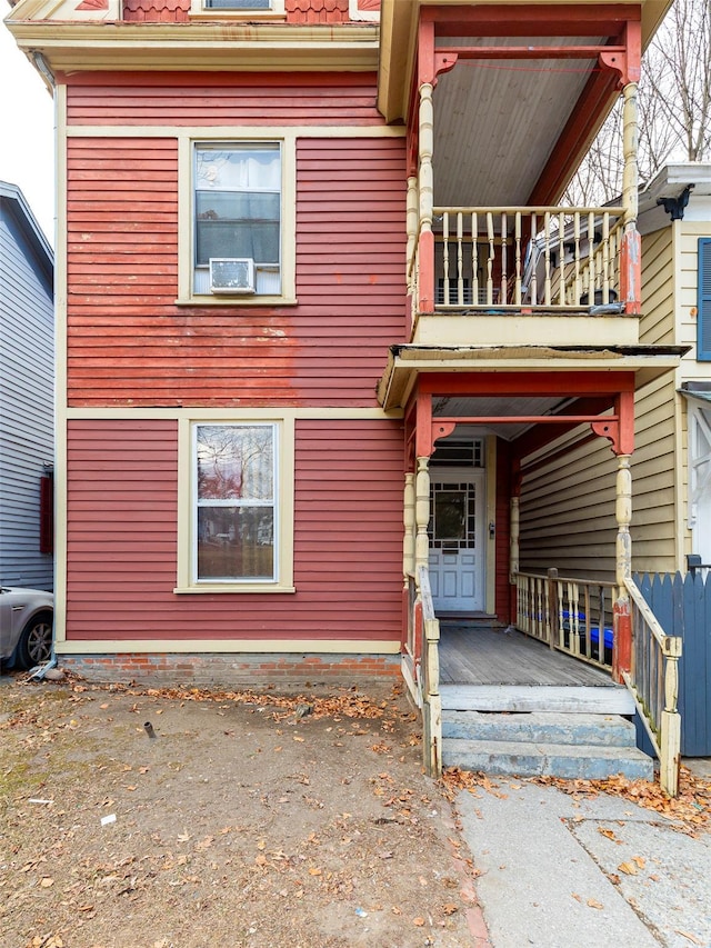 view of front of house featuring a balcony