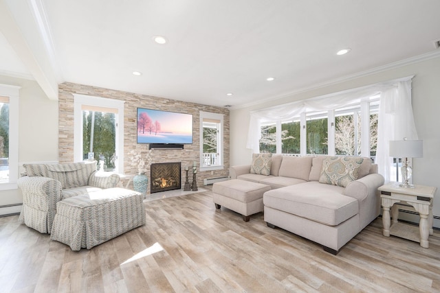 living area with a baseboard radiator, recessed lighting, a fireplace, ornamental molding, and light wood finished floors