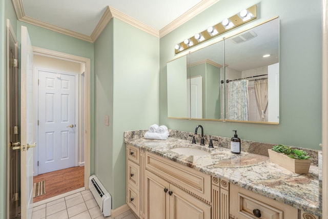 full bathroom featuring a baseboard heating unit, vanity, visible vents, tile patterned floors, and crown molding