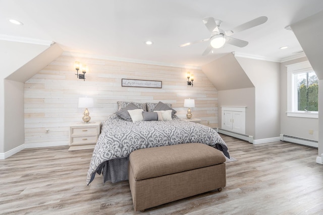 bedroom featuring light wood-style floors, a baseboard radiator, and crown molding