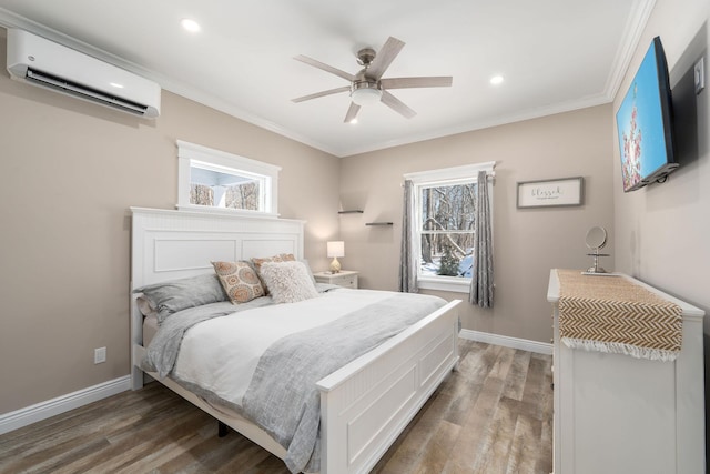 bedroom featuring multiple windows, a wall mounted AC, dark wood finished floors, and baseboards