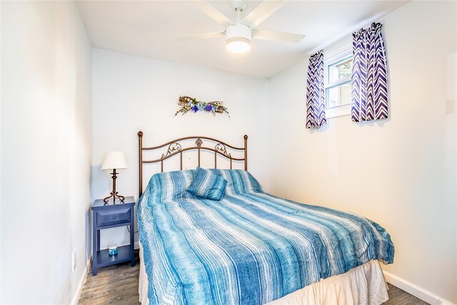 bedroom with ceiling fan and hardwood / wood-style floors