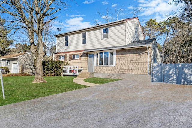 view of front of home with a front lawn