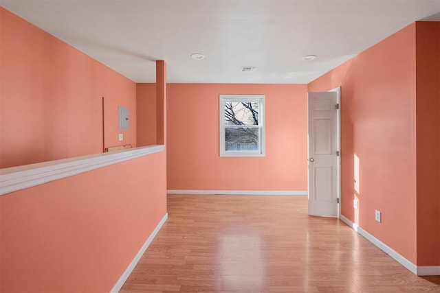 corridor featuring light hardwood / wood-style floors