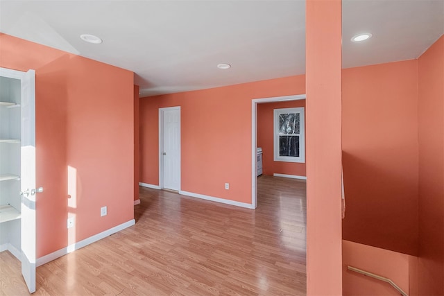 unfurnished room featuring light hardwood / wood-style floors