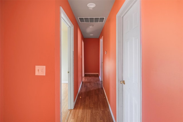 hall with light hardwood / wood-style flooring