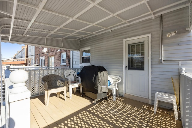 wooden terrace featuring grilling area