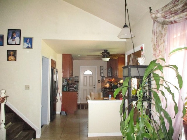 interior space with ceiling fan and lofted ceiling